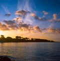 Colorful sunrise on the Tuscan coast in winter with the sun reflecting on the clouds and sea, shot with analogue film technique