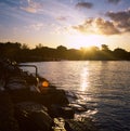 Colorful sunrise on the Tuscan coast in winter with the sun reflecting on the clouds and sea, shot with analogue film technique