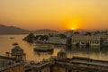 Colorful sunset above architecture and lake water in Udaipur, Rajasthan, India Royalty Free Stock Photo