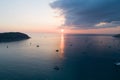 Colorful sunset above the sea surface with sail boats Aerial view drone fly over Phuket sea Reflected sun golden light on a water Royalty Free Stock Photo