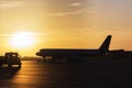 Colorful of sunset in the airport with aeroplane wing, Business and transportation concept