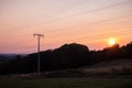 Colorful sunset behind power lines