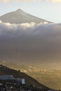 Sunset on tenerife island with view on villages on slope and teide volcano