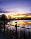 Colorful sunset at the castle bridge over the crystal ice of the lake Royalty Free Stock Photo