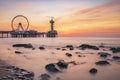 Colorful sunset on coastline, beach, pier ferris wheel, Scheveningen, the Hague Royalty Free Stock Photo