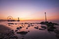 sunset on coastline, beach, pier and ferris wheel, Scheveningen, the Hague Royalty Free Stock Photo