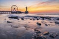 Colorful sunset on coastline, beach, pier and ferris wheel, Royalty Free Stock Photo