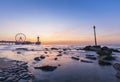 Colorful sunset on coastline, beach, pier and ferris wheel, Scheveningen, the Hague Royalty Free Stock Photo