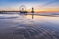 Colorful sunset on coastline, beach, pier and ferris wheel, Scheveningen, the Hague Royalty Free Stock Photo