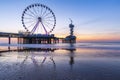 Colorful blue hour sunset on coastline, beach, pier and ferris wheel, Scheveningen, the Hague Royalty Free Stock Photo