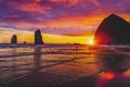 Colorful Sunset Dancing Sun Haystack Rock Sea Stacks Canon Beach Oregon Royalty Free Stock Photo