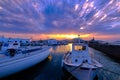 Colorful sunset in fishermen village and harbour. Royalty Free Stock Photo