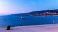 Colorful sunset in front of the city of Trieste Royalty Free Stock Photo
