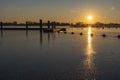 A colorful sunset at a frozen lake Zoetermeerse Plas with buoys and boat dock in Zoetermeer Royalty Free Stock Photo