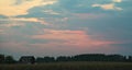 Colorful sunset over corn field, summer landscape Royalty Free Stock Photo