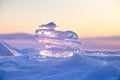 Colorful sunset over the crystal ice of Baikal lake