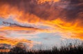 Colorful sunset over field grasses. Royalty Free Stock Photo