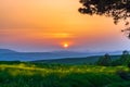 Colorful sunset over green fields Royalty Free Stock Photo