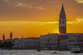 Colorful sunset over the historic center of Venice, Italy, with sun rays filtering from the Campanile di San Marco above the Doge` Royalty Free Stock Photo