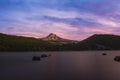 Colorful sunset over Hood Mountain from Laurance Lake in Oregon Royalty Free Stock Photo