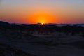 Colorful sunset over the Namib desert, Namibia, Africa. Mountains, dunes and Acacia trees silhouette in backlight. Orange red clea Royalty Free Stock Photo