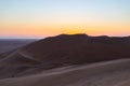 Colorful sunset over the Namib desert, Namibia, Africa. Scenic sand dunes in backlight in the Namib Naukluft National Park Royalty Free Stock Photo