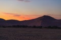 Colorful sunset over the Namib desert, Namibia, Africa. Scenic sand dunes in backlight in the Namib Naukluft National Park, Swakop Royalty Free Stock Photo