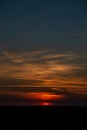 colorful sunset over the sea lake with dark red clouds Royalty Free Stock Photo