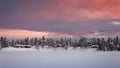 Colorful sunset over winter landscape with snow covered forest . Royalty Free Stock Photo