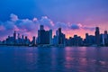 Boatside view of colorful sunset over the cityscape of Chicago and Lake Michigan.