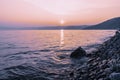 Colorful sunset on a rocky beach, late summer evening Royalty Free Stock Photo