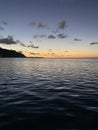 Tropical sunset over South Pacific Ocean in Moorea, French Polynesia from sailing catamaran Royalty Free Stock Photo