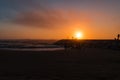 Colorful sunset with silhouettes in contrast in breakwater with sea drops on Vieira beach, Marinha Grande PORTUGAL