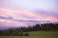 Picturesque sunset cloudscape over the Jura mountains. Beautiful evening sky landscape over the meadows and forest. Royalty Free Stock Photo