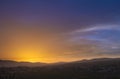 Colorful sunset sky over the city with hills. Jarash Jordan