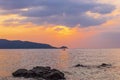 Colorful sunset sky over the ocean near the Patong beach of the Phuket Island in Thailand Royalty Free Stock Photo