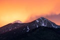 Colorful sunset sky over snow capped mountains in Flagstaff, Arizona. Royalty Free Stock Photo