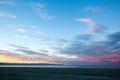 Colorful sunset sky with overcast clouds at Wharariki Beach, Nelson