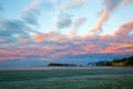 Colorful sunset sky with overcast clouds at Wharariki Beach, Nelson