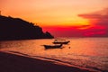 Colorful sunset in tropical island, beach and local boats in Bali Royalty Free Stock Photo
