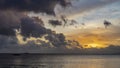 Colorful sunset on a tropical island. Pink and purple clouds in the sky