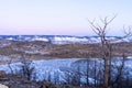 Colorful sunset on winter crack ice lake Baikal . Stunning sunset above the frozen surface of the lake Baikal Royalty Free Stock Photo