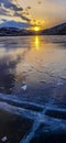 Colorful sunset on winter crack ice lake Baikal . Stunning sunset above the frozen surface of the lake Baikal Royalty Free Stock Photo