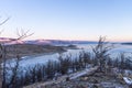 Colorful sunset on winter crack ice lake Baikal . Stunning sunset above the frozen surface of the lake Baikal Royalty Free Stock Photo