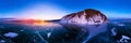 Colorful sunset on winter lake Baikal near an island covered with ice. . Cylindrical panorama 360