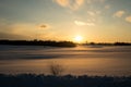 colorful sunset in winter over countryside fields covered in snow Royalty Free Stock Photo