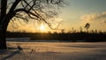 colorful sunset in winter over countryside fields covered in snow Royalty Free Stock Photo