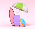 Colorful surfboard, beach ring, umbrellas and lugagge on pink background.