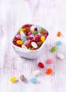 Colorful sweet jelly beans or gummy candies in white ceramic bowl Royalty Free Stock Photo