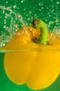 Colorful sweet pepper drops in water